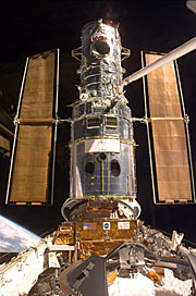 Hubble Hubble has just been "grappled" by ESA astronaut Jean-François Clervoy. It is now being put on the "berthing platform" which has been specially constructed to accommodate the telescope during the repairs.