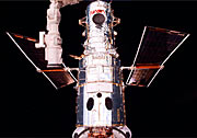 Servicing Mission 2 Hubble after capture with the remote manipulator arm. Ready for surgery!